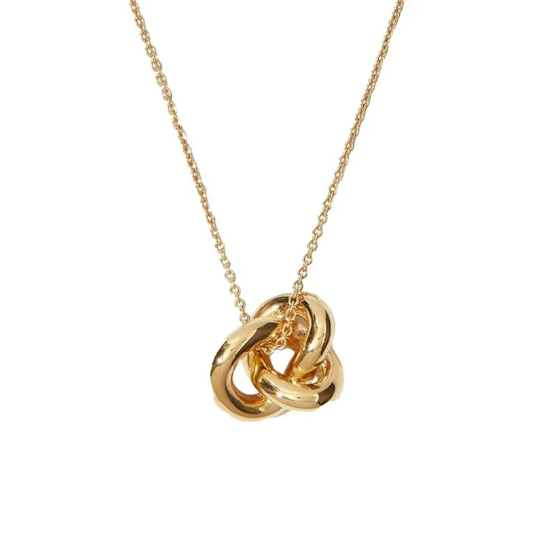 Interlocking Trio Necklace in gold tone on a white background